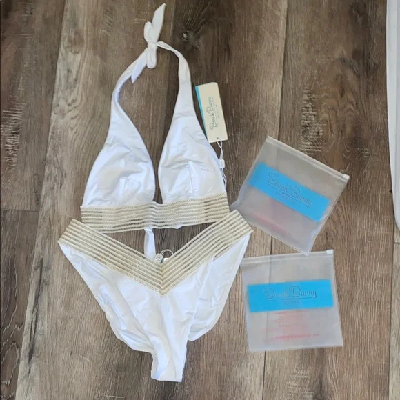 NWT Beach Bunny White and Gold Bikini 2 piece set
Halter top (L)
Bottoms (XL) - Picture 7 of 9